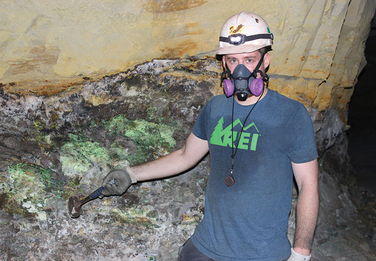 Travis olds posing in a mine.