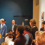A woman giving a talk to a group of people