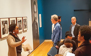 A woman giving a talk to a group of people