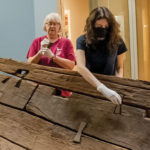 2 women working on an ancient egyptian boat