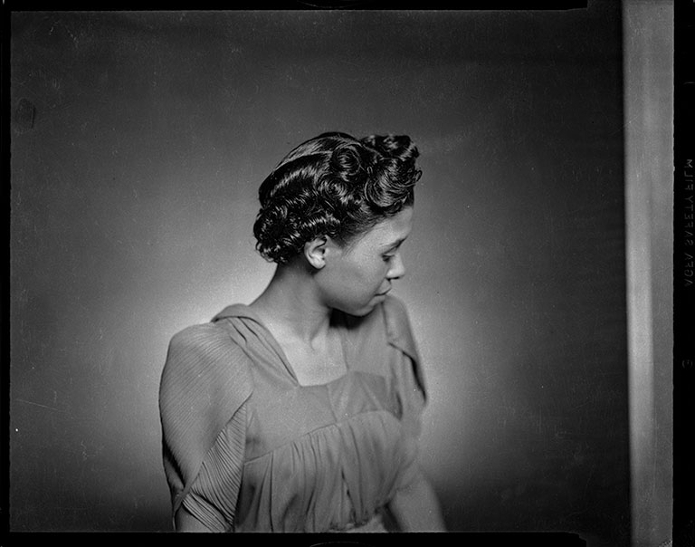 Woman in profile modeling hairstyle