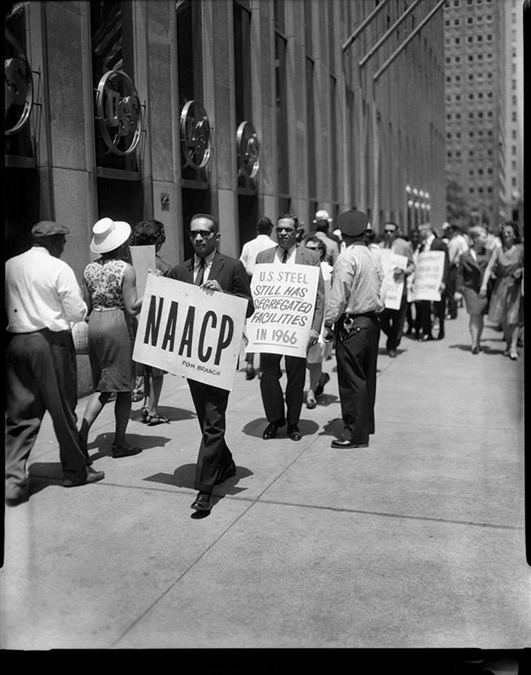 Protesters outside of U.S. Steel building, including Byrd Brown with sign reading “NAACP PGH Branch
