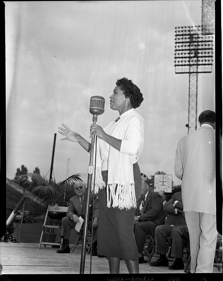 Woman singing on stage