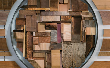 A detail of a sculpture made of reclaimed wood.