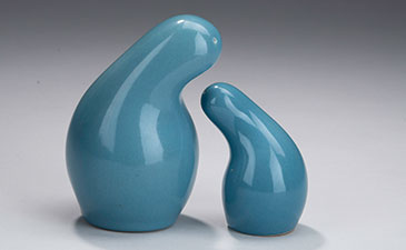 A set of blue organic shaped salt and pepper shakers