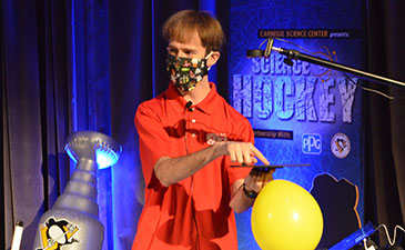 A man demonstrating a science experiment