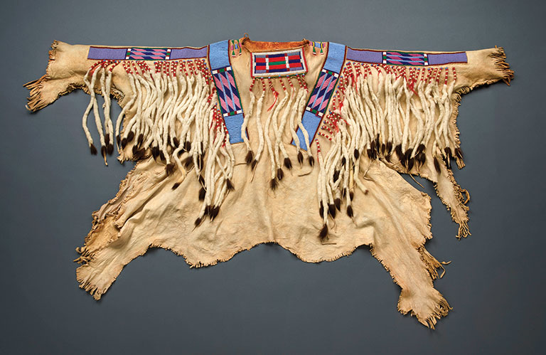 a native american war shirt spread out for display