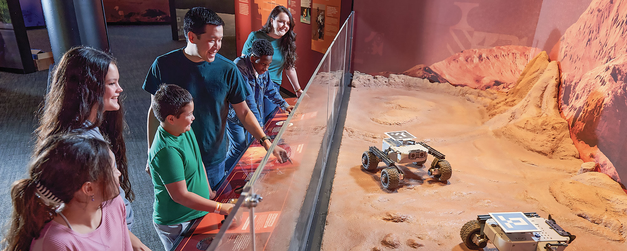 A group of young people in the Mars exhibition
