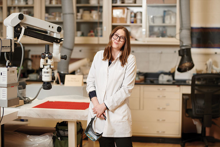 An art conservator in her work area