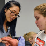 Tour Your Future participant Dallas Mercurio gets an up-close look at a model of a human heart during an interactive tour at Allegheny General Hospital.