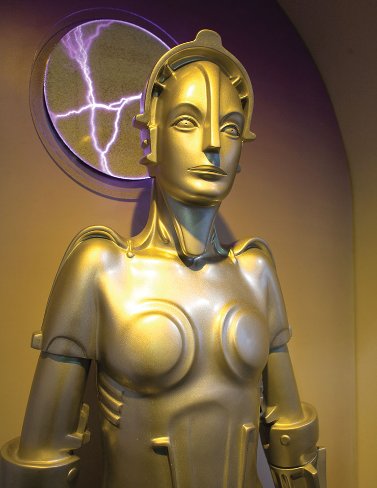 A gold colored female robot