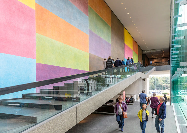 A view of a colorful wall along a staircase