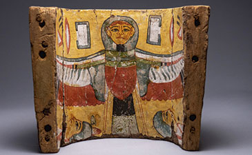 An egyptian artifact of a human figure spreading its wings.