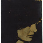 An abstract artwork featuring a deep black background with a gold-tinged rectangle, suggesting depth and texture.