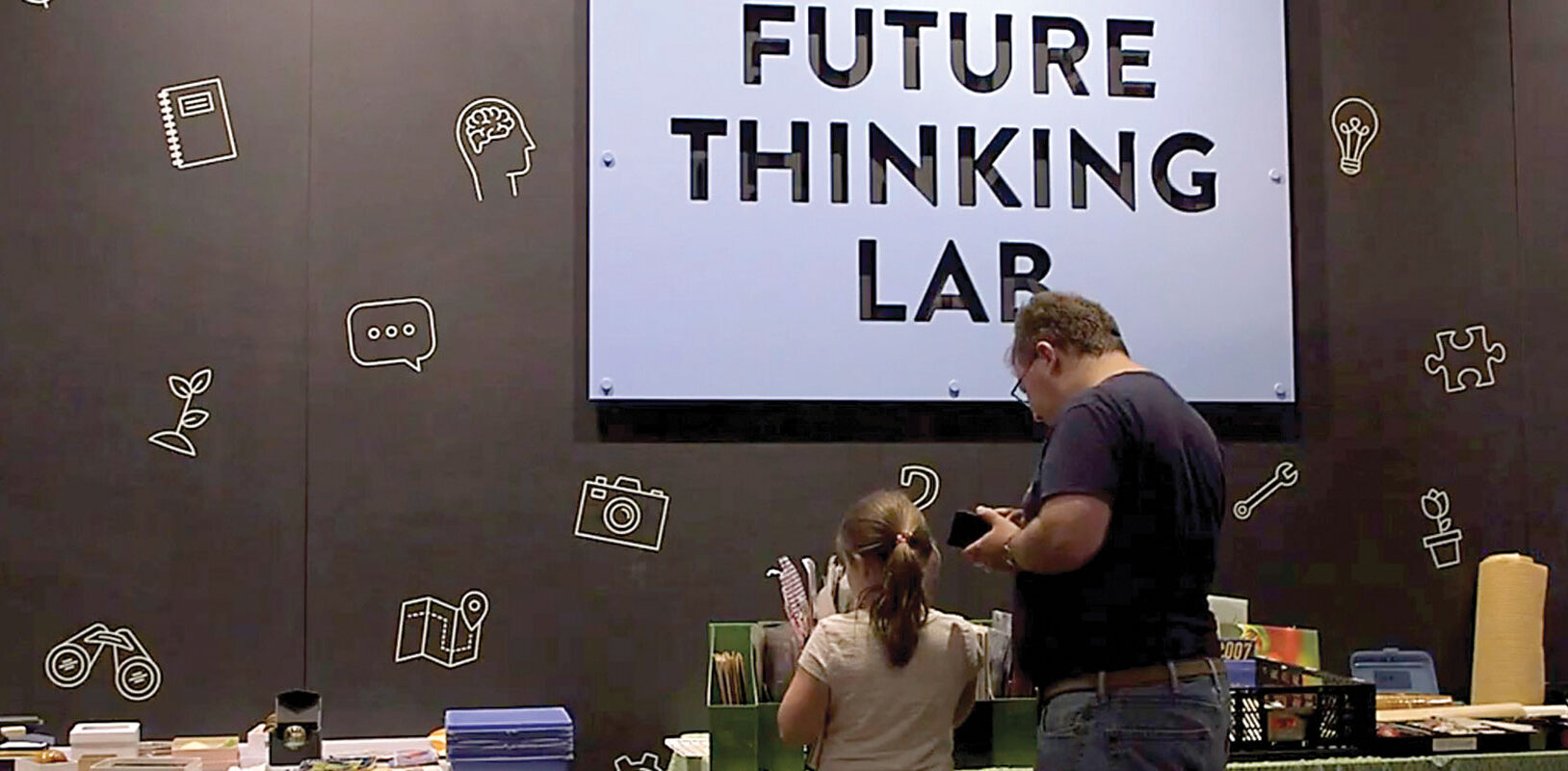 Museum visitors exploring an exhibit.