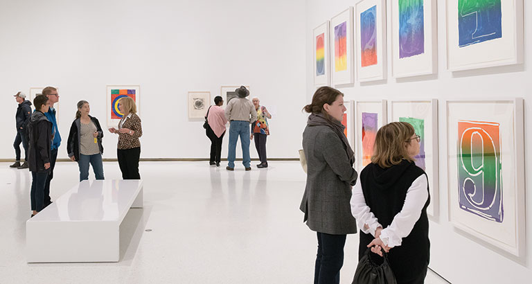 People exploring the art museum exhibition