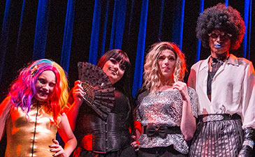 A group of teens dressed in drag.