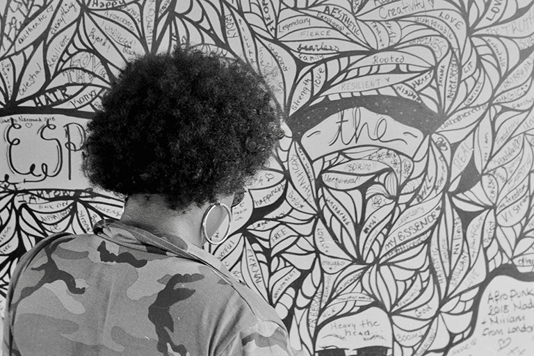 A woman viewing an art exhibit.
