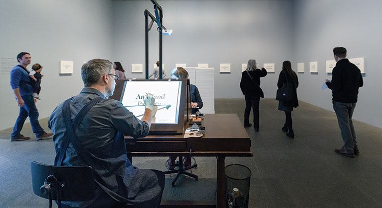 Artist at work in a gallery