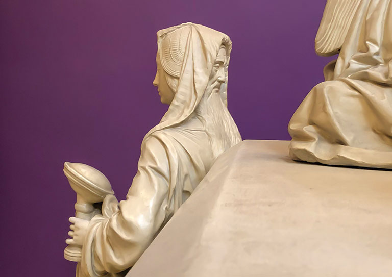Cast of tomb depicting a figure with 2 faces.