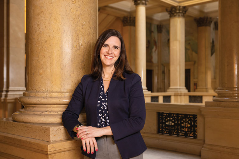 A portrait of Carey Miller near the Grand Staircase of Carnegie Museum.