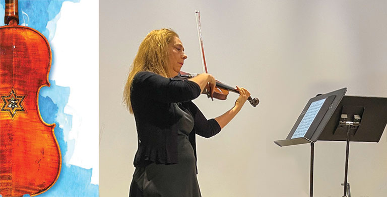 A woman dressed in black playing a violin. The words Violins of Hope are displayed next to her.