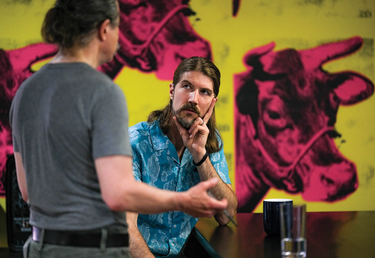 An instructor speaking to a student.